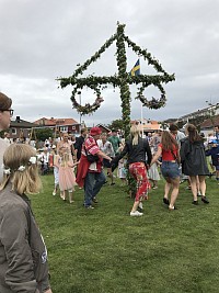 Traditional song and dance around the May pole
